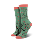 Crew socks in teal with a pink toe and heel.  Features a repeating pattern of black cherry blossom branches and pink flowers.