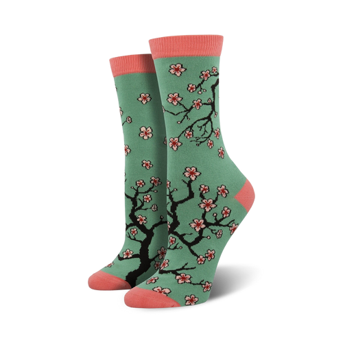 Crew socks in teal with a pink toe and heel.  Features a repeating pattern of black cherry blossom branches and pink flowers.
