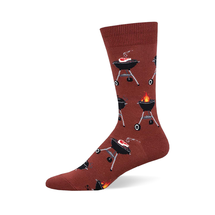 A single crew sock in reddish-brown covered in a pattern of black BBQ grills. Some grills show meat cooking; others have flames. }}