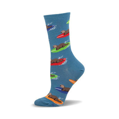 a blue sock with a pattern of otters surfing on colorful surfboards.