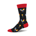 Black crew socks with a red cuff featuring colorful roosters and yellow lollipops on a repeating pattern.