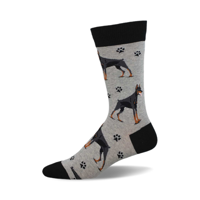 side view of doberman socks; gray background with black doberman pinschers and paw prints.