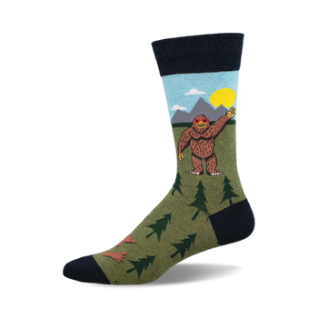 side view of peace out bigfoot socks.  bigfoot in sunglasses waves goodbye amidst a mountain scene.  fun, whimsical design.