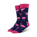 Pair of navy blue crew socks featuring a pink flamingo pattern.  Pink cuffs add a pop of color. Fun and stylish!