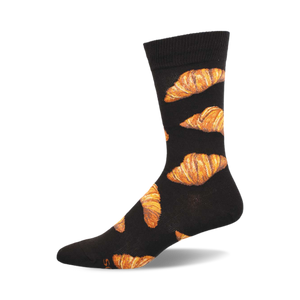 Black crew socks with a repeating pattern of golden brown croissants. These fun socks are perfect for adding a touch of personality to any outfit.