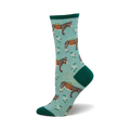 Crew socks featuring donkeys carrying flowers on a light teal background.  The socks are teal and green with a repeating whimsical pattern.