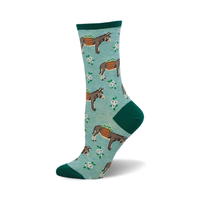 side view of "hauling ass" socks; teal background with donkeys carrying baskets and white flowers.