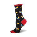 Crew socks in black with colorful rooster and lollipop designs. Red accents at the heel and toe.