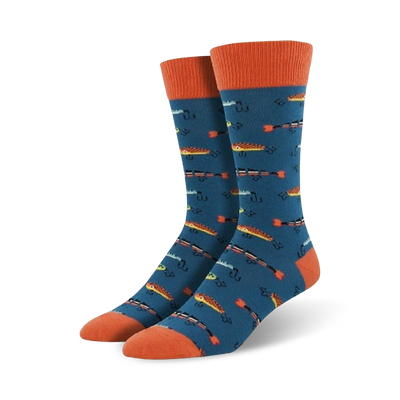 mens crew socks in electric blue with all-over pattern of orange fish & fish hooks. heel and toe cap are orange.   