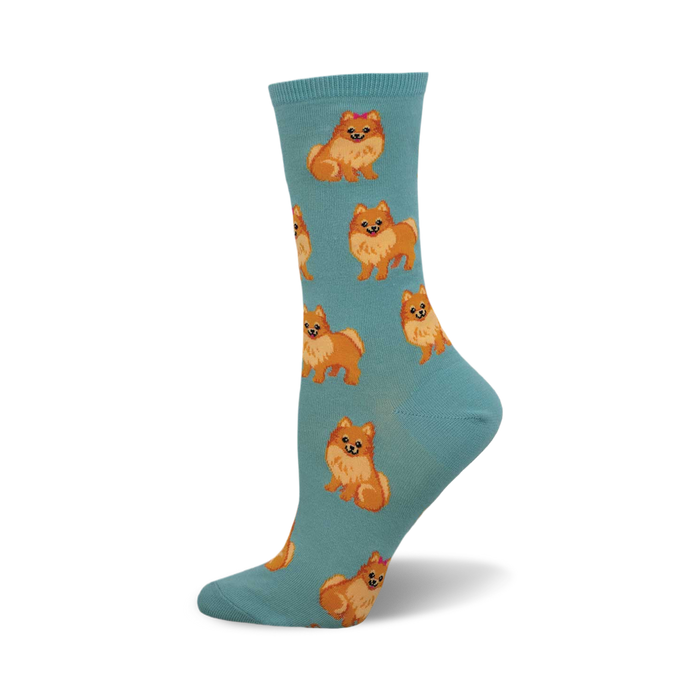 side view of teal cotton crew socks featuring a repeating pattern of adorable pomeranian dogs.  