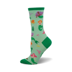 Crew socks in teal green with colorful mermaids, octopus, and coral. Green cuffs add a pop of color. 