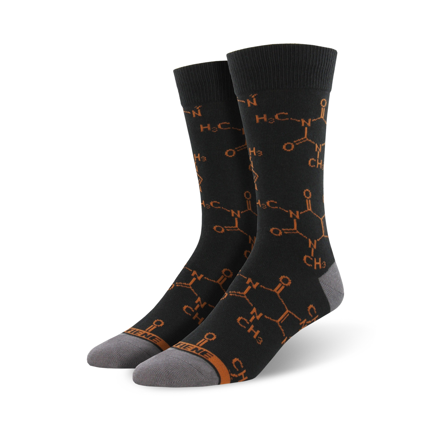 Pair of crew socks in dark grey with a repeating burnt orange caffeine molecule pattern.  The socks have grey heels and toes.