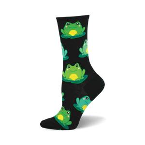 Black crew socks with a fun pattern of smiling green frogs sitting on lily pads.