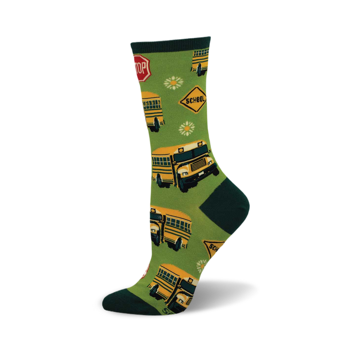 side view of 'school bus' socks featuring yellow school buses, stop signs, and daisies on a green background. }}