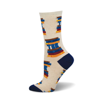 side view of cream-colored crew socks featuring a repeated pattern of stacked books with "tbr" (to be read) in blue.  perfect gift for book lovers.