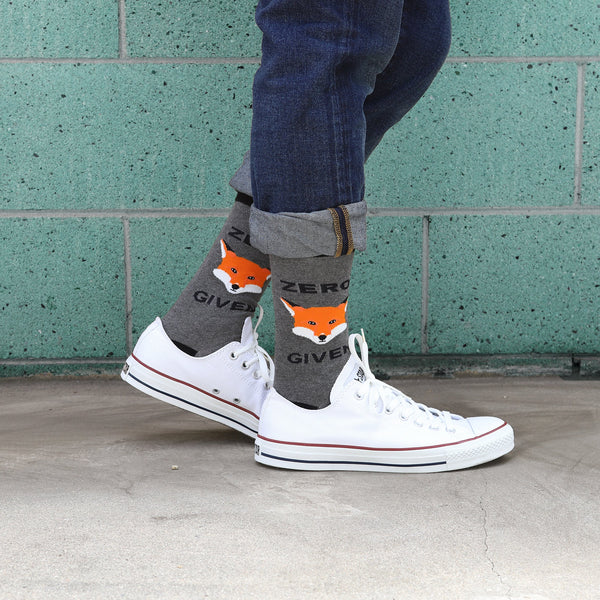 Lifestyle shot showing a person wearing the Zero Fox Given socks with jeans and white Converse sneakers. [lf]