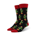 Pair of crew socks; black background with repeating pattern of cacti wearing Santa hats and Christmas lights; red cuffs.