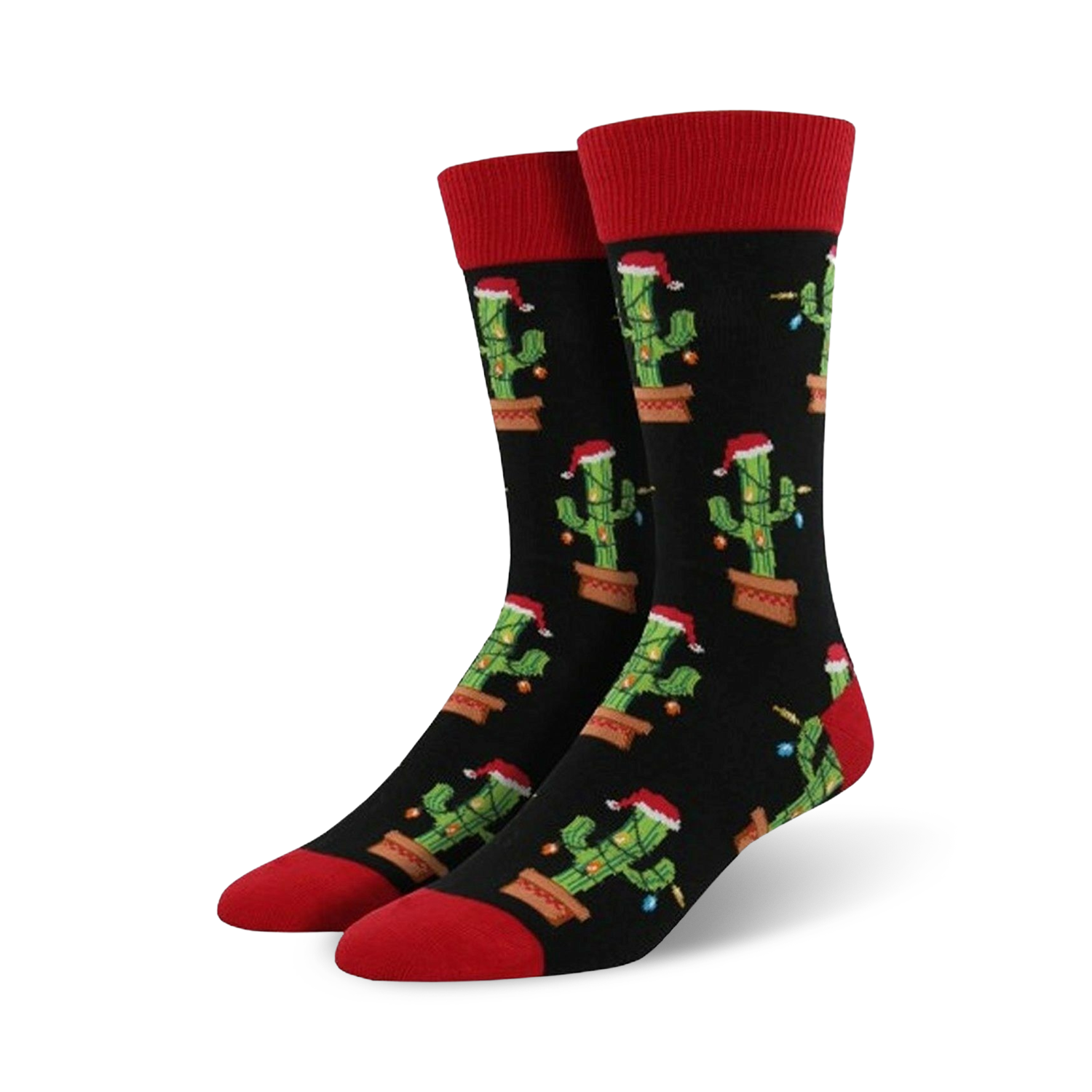 Pair of crew socks; black background with repeating pattern of cacti wearing Santa hats and Christmas lights; red cuffs.