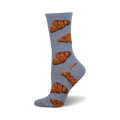 A single light-blue crew sock with a pattern of brown croissants. These fun socks are perfect for the pastry lover in your life.