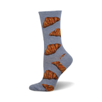 A single light-blue crew sock with a pattern of brown croissants. These fun socks are perfect for the pastry lover in your life.