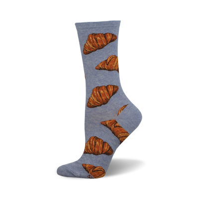 side view of flaky croissant socks; light blue socks with a pattern of brown croissants.