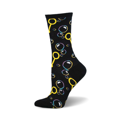 side view of black crew sock featuring a playful pattern of colorful bubbles and bubble wands.  "blowing bubbles" sock design.