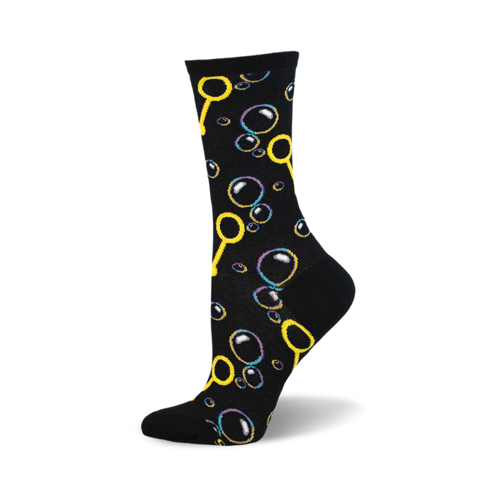 side view of black crew sock featuring a playful pattern of colorful bubbles and bubble wands.  