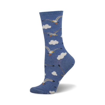 side view of 'mine now' socks; blue socks with a pattern of seagulls in flight against a cloudy sky.