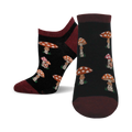 A pair of women's ankle socks in black and burgundy. The socks have a pattern of illustrated mushrooms in shades of orange and red.