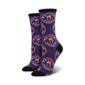 Pair of women's crew socks in purple with a repeating pattern of orange circles that say 'Psychic Reader' and contain a blue hand graphic.