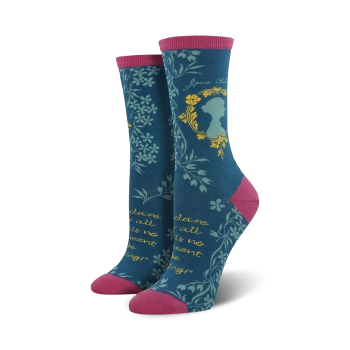 jane austen socks for women with a blue body, pink toe, heel, and top. there is a portrait of jane austen in a blue cameo on the front of the socks, surrounded by a wreath of flowers. text reads 'jane austen' above the portrait and '{dare to be different}' below the portrait.  