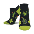 A pair of ankle socks with a black background and a fun pattern of various cacti and succulents in shades of green. The socks have lime green heels and toes.