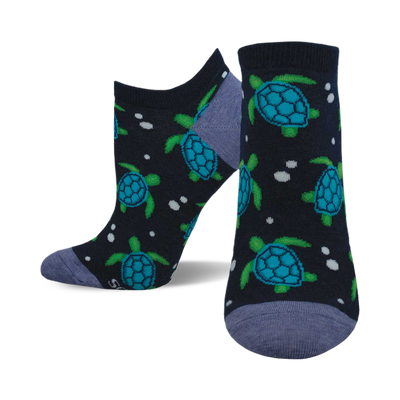 front view of tide-y turtles socks; navy blue socks with teal turtles and white dots.