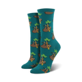 Pair of teal crew socks with a pattern of sloths wearing gold chains and hanging from palm fronds. 