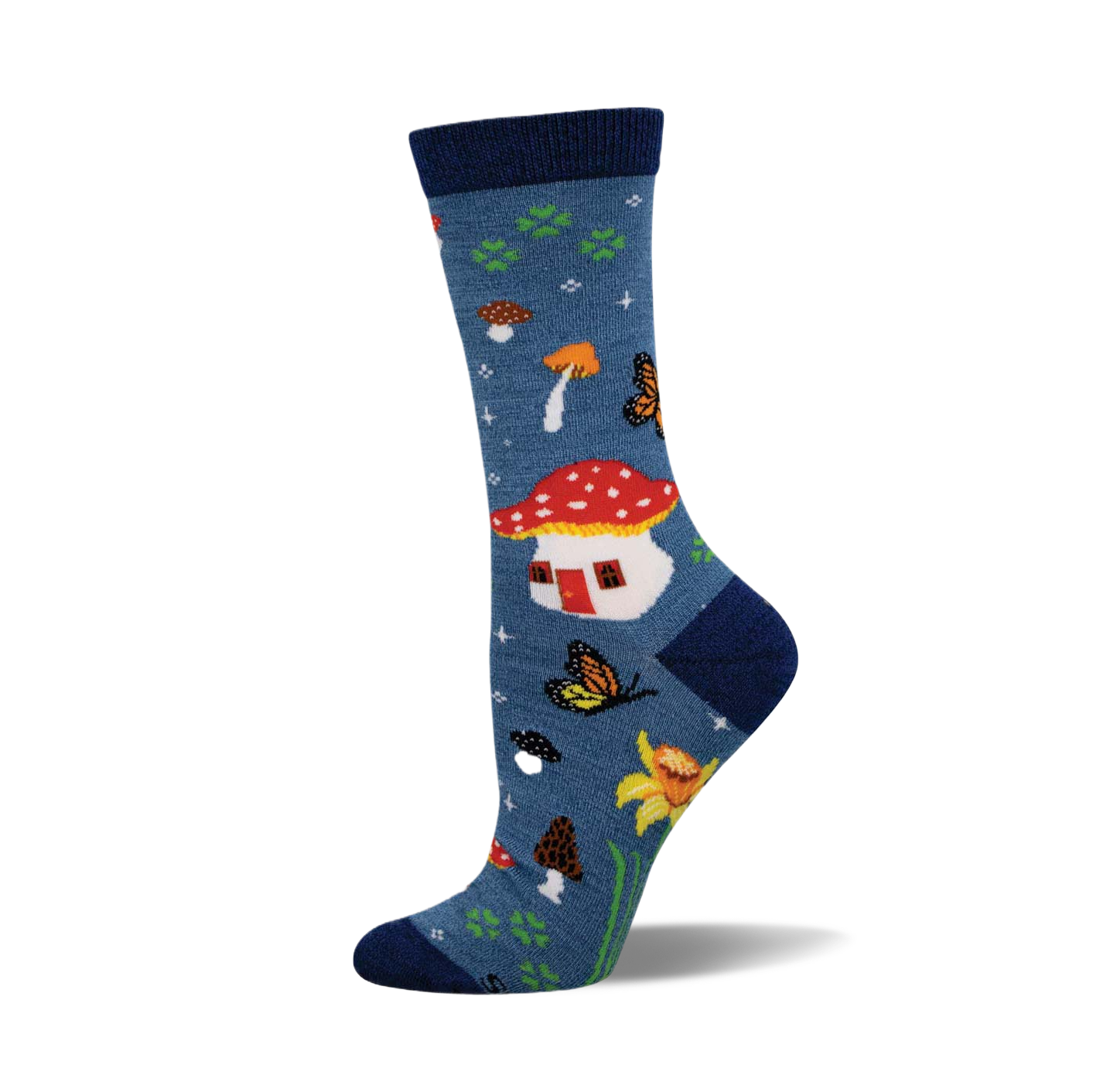 Crew socks in blue featuring mushrooms, butterflies, daffodils, and a mushroom house.  A whimsical nature-inspired design.