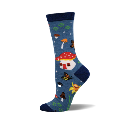 Blue crew socks featuring a red and white mushroom house, orange and brown mushrooms, yellow butterflies, and yellow flowers.