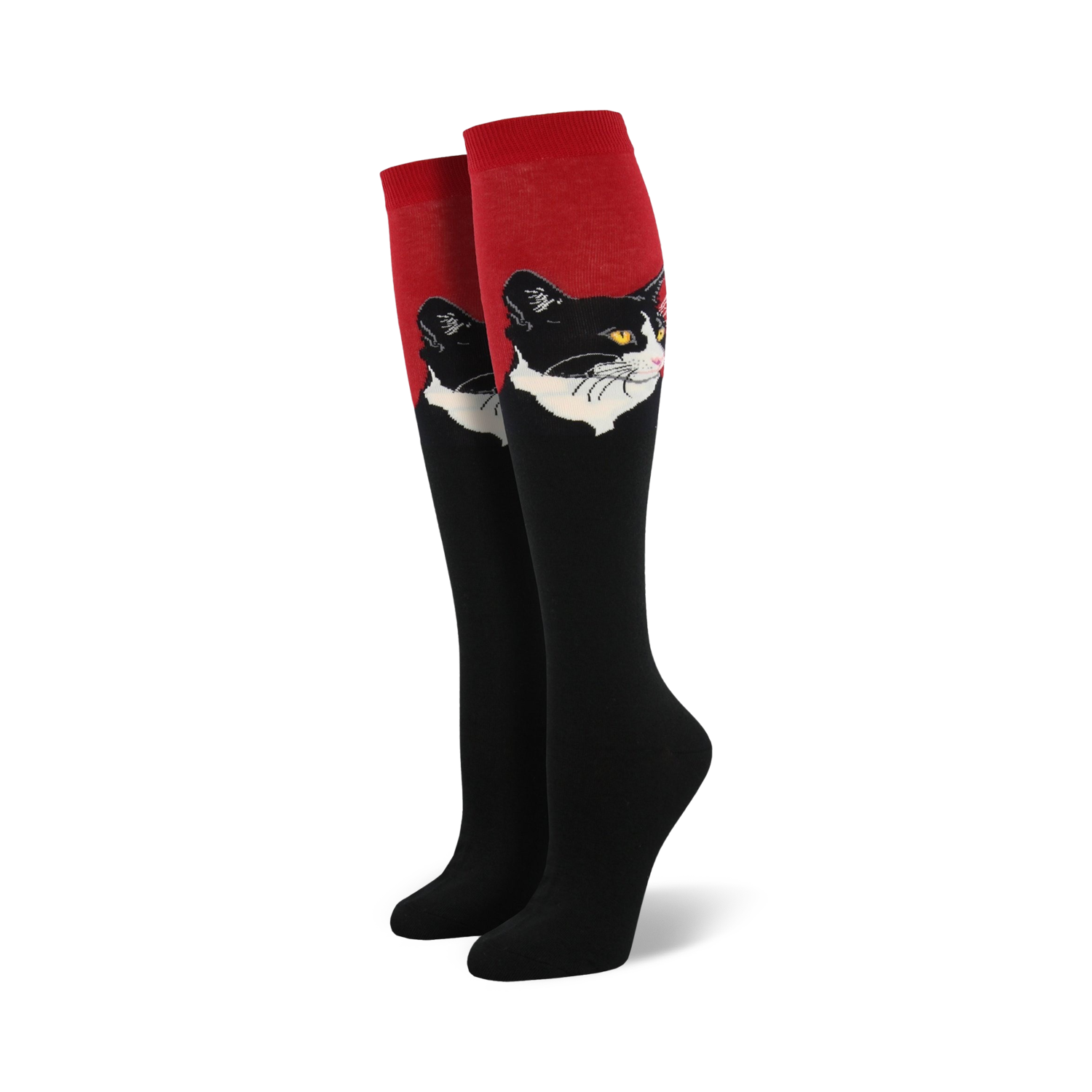 Close-up view of a pair of red and black knee-high socks with a black and white cat portrait.