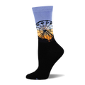 Crew socks in black and periwinkle blue, featuring a detailed Ferris wheel graphic at sunset against a gradient background.