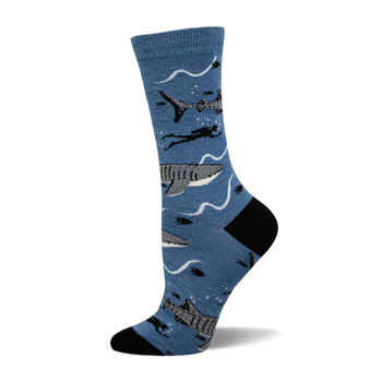 Crew socks in blue featuring whale sharks, divers, and wavy lines.  Black heel and toe.