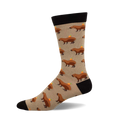 Crew socks showcasing a beige background with repeating illustrations of brown capybaras carrying small oranges.