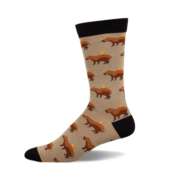 Crew socks showcasing a beige background with repeating illustrations of brown capybaras carrying small oranges.