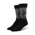 Pair of men's crew socks. Black and gray color scheme.  Features a graphic of a Velociraptor's face.