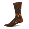 Olive green crew socks adorned with colorful monarch butterflies.  The socks have an orange and yellow butterfly design and a brown cuff.