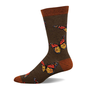 Olive green crew socks adorned with colorful monarch butterflies.  The socks have an orange and yellow butterfly design and a brown cuff.