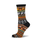 Black crew socks with a colorful Halloween-themed fair isle knit pattern featuring pumpkins, ghosts, and skeletons in orange, white, and green.