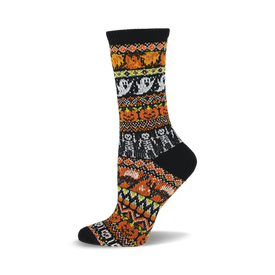 a black sock with orange, yellow, and white patterned stripes featuring pumpkins, ghosts, and skeletons.