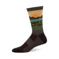 Crew sock in earthy brown, green, and yellow with a sun, mountains, blue water, and "TAKE IT OUTSIDE" text.