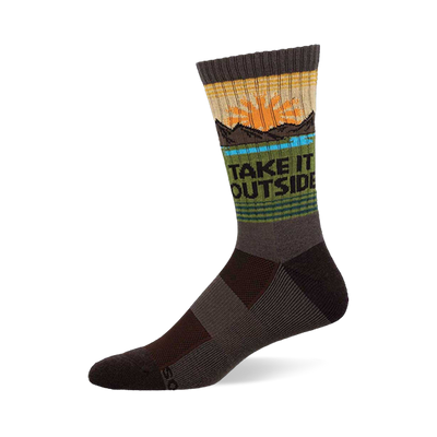 Crew sock in earthy brown, green, and yellow with a sun, mountains, blue water, and "TAKE IT OUTSIDE" text.