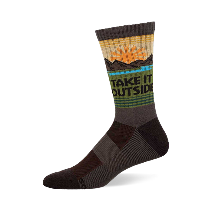 Crew sock in earthy brown, green, and yellow with a sun, mountains, blue water, and 