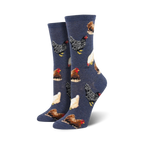 Pair of crew socks featuring various colorful chicken illustrations on a navy blue background. 